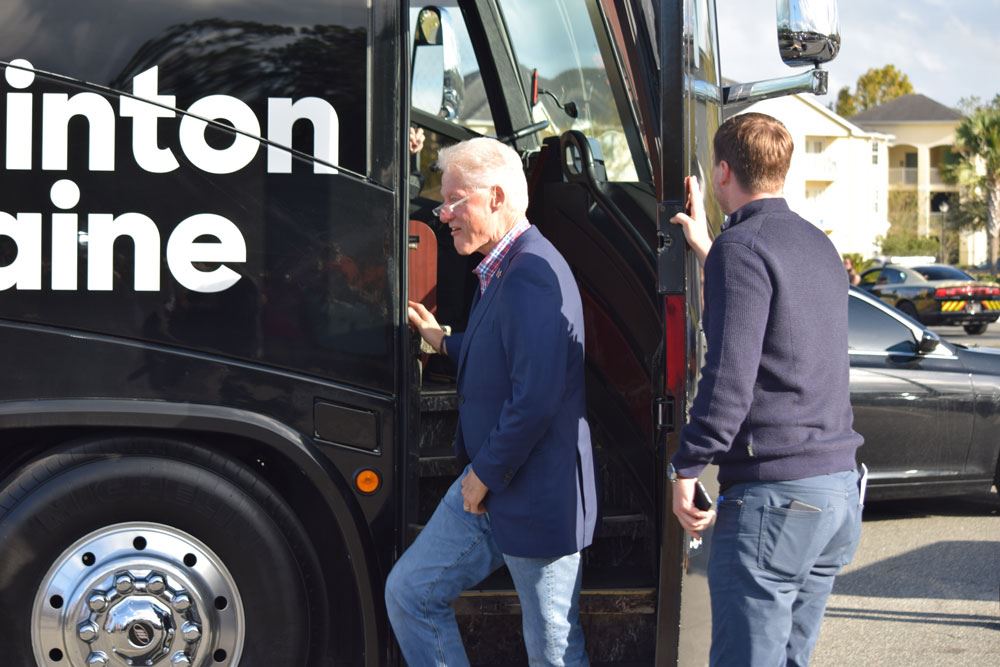 Former President Bill Clinton exits the campaign bus in Palatka.