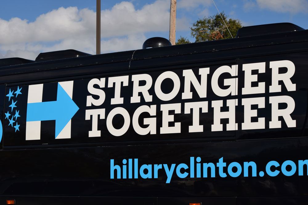 Former President Bill Clinton arrives in a Hillary Clinton tour bus!